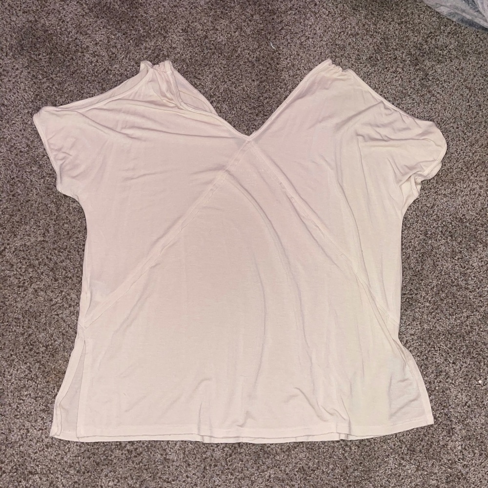 An american eagle outfitters top. The top is an off the shoulder and very flowy.